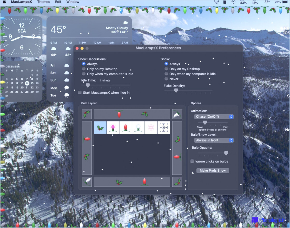 Maclampsx met les lumières de Noël et la neige qui tombe sur le bureau Mac
